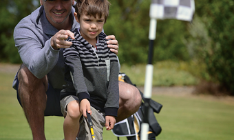 Dad Son Putting